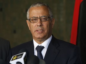 FILE - In this Oct. 8, 2013 file photo, then Libyan Prime Minister Ali Zidan speaks during a press conference in Rabat, Morocco. Witnesses say militiamen in Libya abducted Zidan, a former prime minister, in the capital, Tripoli late on Sunday, Aug. 13, 2107. They say Zidan was led away by an armed group out of a Tripoli hotel where he was holding meetings with security officials. (AP Photo/Abdeljalil Bounhar, File)