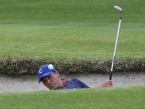 Doug Ghim hits out of a bunker on the first hole during the championship round of the USGA Amateur Golf Championship at the Riviera Country Club in the Pacific Palisades area of Los Angeles, Sunday, Aug. 20, 2017. (AP Photo/Reed Saxon)
