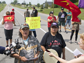 A spokeswoman for a group of indigenous protestors reads a statement on Aug. 10, 2017 near the site of a road blockade in Caledonia, Ontario.