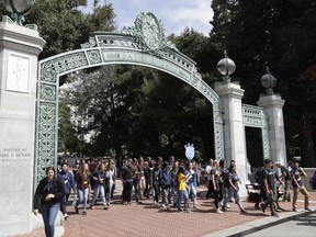 Students walk on the UC Berkeley campus Tuesday, Aug. 15, 2017, in Berkeley, Calif. UC Berkeley Chancellor Carol Christ says the university is committed to protecting free speech, and is allowing former Breibart editor Ben Shapiro to visit and speak on campus, despite concerns about violent protests. (AP Photo/Marcio Jose Sanchez)