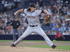 San Francisco Giants starting pitcher Jeff Samardzija delivers a pitch to a San Diego Padres batter during the first inning of a baseball game, Monday, Aug. 28, 2017, in San Diego. (AP Photo/Orlando Ramirez)