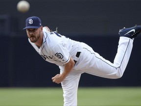 San Diego Padres starter Travis Wood throws a pitch to a San Francisco Giants batter during the first inning of a baseball game Wednesday, Aug. 30, 2017, in San Diego. (AP Photo/Orlando Ramirez)