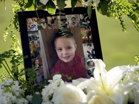 FILE - This July 19, 2017 file photo shows a portrait of five-year-old Aramazd Andressian Jr. at a memorial in his memory at the Los Angeles County Arboretum in Arcadia, Calif. Aramazd Andressian Sr. has pleaded guilty to killing his 5-year-old son. Andressian Sr. entered the plea to first-degree murder Tuesday, Aug. 1, 2017 in Los Angeles County Superior Court in Alhambra, Calif. He previously pleaded not guilty to a murder charge and was being held on $10 million bail. (Leo Jarzomb /Los Angeles Daily News via AP, file)
