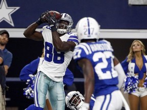 Dallas Cowboys wide receiver Dez Bryant (88) uses his helmet to control a catch before running into the end zone for a touchdown as Indianapolis Colts cornerback Nate Hairston (27) watches in the first half of a preseason NFL football game, Saturday, Aug. 19, 2017, in Arlington, Texas. (AP Photo/Michael Ainsworth)
