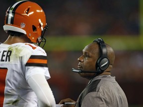 Cleveland Browns head coach Hue Jackson, right, talks with quarterback Brock Osweiler in the first half of an NFL preseason football game against the New York Giants, Monday, Aug. 21, 2017, in Cleveland. (AP Photo/Ron Schwane)