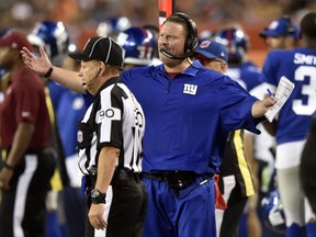 New York Giants head coach Ben McAdoo argues with down judge Mike Spanier in the first half of an NFL preseason football game against the Cleveland Browns, Monday, Aug. 21, 2017, in Cleveland. (AP Photo/David Richard)