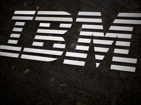 FILE - In this April 26, 2017, file photo, the IBM logo is displayed on the IBM building in Midtown Manhattan, in New York. In a judge's ruling dated Friday, Aug. 4, 2017, IBM Corp. owes the state of Indiana $78 million in damages stemming from the company's failed effort to automate much of Indiana's welfare services. Indiana and IBM sued each other in 2010 after then-Gov. Mitch Daniels canceled the company's $1.3 billion contract. (AP Photo/Mary Altaffer, File)