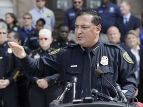 FILE - In this July 25, 2017 file photo, Houston Police Chief Art Acevedo and other law enforcement take part in public safety event in Austin, Texas. Even as a new Texas law targeting so-called sanctuary cities remains in legal limbo, police chiefs and sheriffs are making changes to comply. Houston police are drafting a policy instructing officers about their responsibilities under the law. Acevedo, an outspoken opponent of Senate Bill 4, said officers will be required to file a report anytime they ask someone about their immigration status. The law goes into effect Sept. 1 unless a federal judge in San Antonio blocks it. (AP Photo/Eric Gay, File)