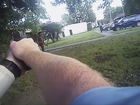 In this image from a July 25, 2017 police body camera video released by District Prosecuting Attorney's Office, Aries Clark, 16, holds a black BB gun that looked like a handgun before he was shot in Marion, Ark. Two eastern Arkansas police officers won't face charges in the fatal shooting of a black teenager outside an emergency youth shelter, a prosecutor said Wednesday, Aug. 9, 2017. (District Prosecuting Attorney's Office via AP)