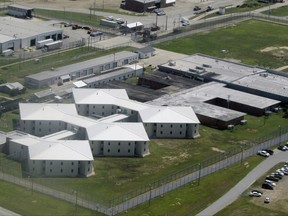 This Aug. 16, 2012 file aerial photo shows, Tucker Prison near Tucker, Ark. Arkansas prison officials said Monday, Aug. 7, 2017 that six inmates have snatched keys from three correctional officers at the maximum security prison and are holding the officers in an area where the prisoners now control the keys and the doors.