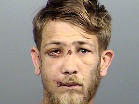 This photo provided by the Marion County Sheriff's Office in Indianapolis shows Jason Brown, who has been charged with murder in the July 27, 2017, shooting death of Southport Police Lt. Aaron Allan in Indianapolis. Brown is scheduled for an initial court hearing Wednesday, Aug. 9, 2017. He has been hospitalized with multiple gunshot wounds after two officers fired on him following Allan's shooting. (Marion County Sheriff's Office via AP)