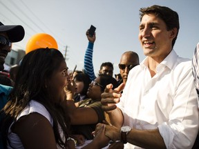 Prime Minister Justin Trudeau greets supporters during Tamil Fest in Toronto on Saturday, August 26, 2017. The Canadian Press/Christopher Katsarov