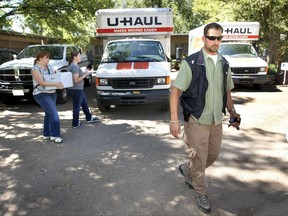FILE - In this Aug. 19, 2009 file photo, Daniel Love, a special agent with the Bureau of Land Management, walks in front of Carl "Vern" Crites' home in Durango Colo., after Crites voluntarily turned over his entire collection of ancient artifacts during a sweeping federal investigation of looting and grave-robbing in the Four Corners region. In a report released Thursday, Aug. 24, 2017, federal investigators released a report that says Love took valuable stones held as evidence and distributed them "like candy" to colleagues and a contractor. (Jerry McBride/The Durango Herald via AP, File)
