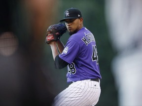 Colorado Rockies starting pitcher German Marquez delivers to Milwaukee Brewers' Neil Walker in the first inning of a baseball game Friday, Aug. 18, 2017, in Denver. (AP Photo/David Zalubowski)