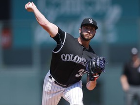 Colorado Rockies starting pitcher Chad Bettis delivers a pitch to Detroit Tigers' Mikie Mahtook in the first inning of a baseball game Wednesday, Aug. 30, 2017, in Denver. (AP Photo/David Zalubowski)