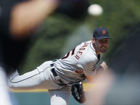 Detroit Tigers starting pitcher Justin Verlander,  reacts as he throws a pitch to strike out Colorado Rockies' Nolan Arenado in the first inning of a baseball game Wednesday, Aug. 30, 2017, in Denver. (AP Photo/David Zalubowski)