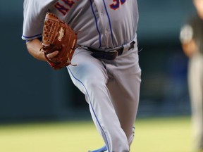 New York Mets starting pitcher Steven Matz throws to a Colorado Rockies batter during the first inning of a baseball game Tuesday, Aug. 1, 2017, Denver. (AP Photo/David Zalubowski)