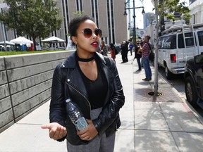 Samaria Alli talks about attending the morning session of a civil trail for pop singer Taylor Swift, Thursday, Aug. 10, 2017, in Denver. Swift testified Thursday that David Mueller, a former radio DJ, reached under her skirt and intentionally grabbed her backside during a meet-and-a-greet photo session before a 2013 concert in Denver.  (AP Photo/David Zalubowski)