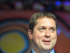 Conservative Party leader Andrew Scheer, right, speaks during the opening of the Assembly of First Nations annual general meeting in Regina, Sask., Tuesday July 25, 2017. Rest and relaxation might top the agenda for most Canadians right now but newly-minted Conservative Leader Scheer is going full-tilt on the barbecue circuit in a bid to introduce himself and boost his party's prospects before 2019.THE CANADIAN PRESS/Mark Taylor