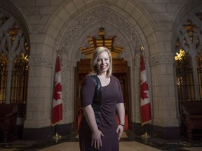 Senator Denise Batters is shown outside the Senate chambers on Parliament Hill, in Ottawa, on Thursday, February 18, 2016. Batters says she has become accustomed to a certain level of personal criticism online, but bringing in the memory of her late husband and former MP Dave Batters is beyond the pale. THE CANADIAN PRESS/Justin Tang