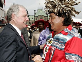 Prime Minister Paul Martin greets Billy Two Rivers, a Mohawk Elder from Kahnawake Quebec, during Canada Day celebrations on Parliament Hill, in Ottawa, Friday July 1, 2005. THE CANADIAN PRESS/Tom Hanson