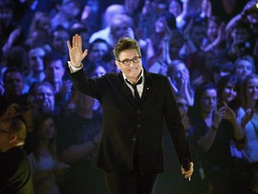 k.d. lang waves to the crod after receiving a Juno for her Canadian Music Hall of Fame induction during the 2013 Juno Awards in Regina on Sunday, April 21, 2013. Alberta crooner lang has invited Jason Kenney to Calgary's Pride festivities - but it appears he won't be attending.The country singer took to Twitter on Tuesday to offer Kenney ??? a leadership candidate for the province's new United Conservative Party - free tickets to a concert if he'd sit down and discuss LGBTQ rights with her. THE CANADIAN PRESS/Liam Richards