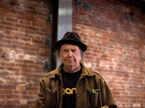 Canadian musician Neil Young leaves a news conference in Vancouver, B.C., on Monday, November 23, 2015. Young recorded his 1976 acoustic album "Hitchhiker" in a single day, but until now fans could only dream of getting their hands on it. THE CANADIAN PRESS/Darryl Dyck
