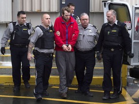 Codey Reginald Hennigar is taken from court in Dartmouth, N.S. on Friday, Jan. 9, 2015. A mentally ill Nova Scotia man who killed his mother and two grandparents will not be allowed more freedom. THE CANADIAN PRESS/Andrew Vaughan