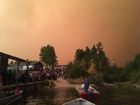 Manitoba MLA Judy Klassen provided this image showing the evacuation of Wasagamack First Nation in northern Manitoba on Tuesday August 29, 2017. The Red Cross is working to carry out the evacuation of three northern Manitoba communities threatened by nearby forest fires. THE CANADIAN PRESS/HO-Judy Klassen