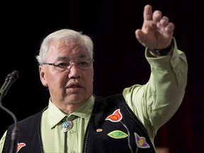 Truth and Reconciliation Commission Chair Justice Murray Sinclair speaks during the Grand entry ceremony during the second day of closing events for the Truth and Reconciliation Commission in Ottawa, Monday June 1, 2015. Sinclair says tearing down tributes that are considered offensive to Indigenous Peoples would be "counterproductive" because it smacks of anger, not harmony. THE CANADIAN PRESS/Adrian Wyld