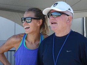 Canadian runner Melissa Bishop, left, and her coach Dennis Fairall during a workout at the University of Windsor on Monday, July 3, 2017. Bishop races the 800 metres at the world track and field championships next week.