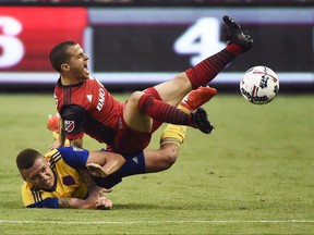 Colorado Rapids defender Kortne Ford (24) and Toronto FC forward Sebastian Giovinco (10) battle for the ball during second half MLS soccer action in Toronto on Saturday, July 22, 2017. Toronto FC and the Blue Jays are currently at different ends of the standings and their TV numbers have gone up and down as a result.THE CANADIAN PRESS/Nathan Denette