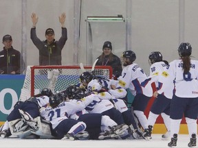 South Korean players celebrate after winning against the Netherlands during their IIHF Ice Hockey Women's World Championship Division II Group A game in Gangneung, South Korea, Saturday, April 8, 2017. THE CANADIAN PRESS/AP-Ahn Young-joon