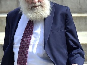 FILE - In this Aug. 14, 2017 file photo, Rabbi Daniel Greer, 77, leaves New Haven Superior Court after he was arraigned on a criminal charge of second-degree sexual assault and risk of injury to a minor in New Haven, Conn. On Tuesday, Aug. 29, 2017, a judge entered not guilty pleas on behalf of Greer, who has been accused of repeatedly abusing a teenage boy at the New Haven school he founded more than a decade ago. (Peter Hvizdak/New Haven Register via AP, File)