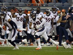 Denver Broncos cornerback Chris Harris (25) runs to the end zone for a touchdown after intercepting a pass during the first half of an NFL preseason football game against the Chicago Bears, Thursday, Aug. 10, 2017, in Chicago. (AP Photo/Nam Y. Huh)