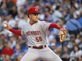 Cincinnati Reds starting pitcher Luis Castillo delivers during the first inning of a baseball game against the Chicago Cubs, Tuesday, Aug. 15, 2017, in Chicago. (AP Photo/Charles Rex Arbogast)