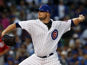 Chicago Cubs starting pitcher Jon Lester throws against the Washington Nationals during the first inning of a baseball game Sunday, Aug. 6, 2017, in Chicago. (AP Photo/Nam Y. Huh)
