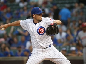 Chicago Cubs starting pitcher John Lackey delivers during the first inning of a baseball game against the Cincinnati Reds Wednesday, Aug. 16, 2017, in Chicago. (AP Photo/Charles Rex Arbogast)
