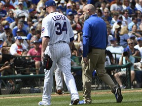 Chicago Cubs starting pitcher Jon Lester (34) leaves the game during the second inning of a baseball game against the Cincinnati Reds, Thursday, Aug. 17, 2017, in Chicago. (AP Photo/David Banks)