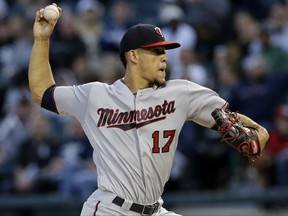 Minnesota Twins starting pitcher Jose Berrios throws to the Chicago White Sox during the first inning of a baseball game Thursday, Aug. 24, 2017, in Chicago. (AP Photo/Nam Y. Huh)