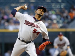 Minnesota Twins starting pitcher Ervin Santana delivers during the first inning of the team's baseball game against the Chicago White Sox on Wednesday, Aug. 23, 2017, in Chicago. (AP Photo/Charles Rex Arbogast)