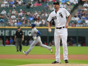 Chicago White Sox starting pitcher Mike Pelfrey (50) stands on the mound after giving up a home run to Toronto Blue Jays' Josh Donaldson, rear, during the first inning of a baseball game in Chicago, on Tuesday, Aug. 1, 2017. (AP Photo/Jeff Haynes)