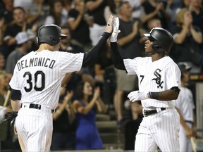 Chicago White Sox's Tim Anderson (7) celebrates his two-run home run with Nicky Delmonico during the fifth inning of the team's baseball game against the Houston Astros on Wednesday, Aug. 9, 2017, in Chicago. (AP Photo/Charles Rex Arbogast)