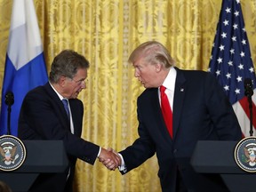 President Donald Trump shakes hands with Finnish President Sauli Niinisto during their joint news conference, Monday, Aug. 28, 2017, in the East Room of the White House in Washington. (AP Photo/Alex Brandon)