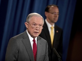 Deputy Attorney General Rod Rosenstein listens at right as Attorney General Jeff Sessions speaks during a news conference at the Justice Department in Washington, Friday, Aug. 4, 2017, on leaks of classified material threatening national security. (AP Andrew Harnik)