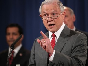 Attorney General Jeff Sessions, accompanied by, from left, National Counterintelligence and Security Center Director William Evanina, Director of National Intelligence Dan Coats, speaks during a news conference at the Justice Department in Washington, Friday, Aug. 4, 2017, on leaks of classified material threatening national security.  (AP Andrew Harnik)