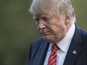 President Donald Trump walks from Marine One across the South Lawn of the White House in Washington, Wednesday, Aug. 23, 2017, as he returns from Reno, Nev.