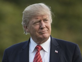 President Donald Trump walks from Marine One across the South Lawn of the White House in Washington, Wednesday, Aug. 23, 2017, as he returns from Reno, Nev.