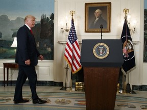 President Donald Trump arrives to speak about the deadly white nationalist rally in Charlottesville, Va., Monday, Aug. 14, 2017, in the Diplomatic Room of the White House in Washington. (AP Photo/Evan Vucci)