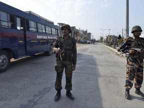 Indian army soldiers patrol the town where the headquarters of the Dera Sacha Sauda sect is based, in Sirsa, in the northern Indian state of Haryana, Saturday, Aug. 26, 2017. Hundreds of security forces marched through the town to maintain calm after supporters of the quasi-religious sect protested the rape conviction of their leader with violence. (AP Photo)